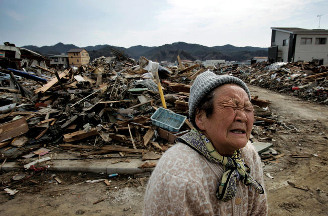 A woman whose house was washed away stands amidst debris in the Shinhamacyo area of Japan following the earthquake and tsunami of March 11.photo: Kuni Takahashi/Polaris